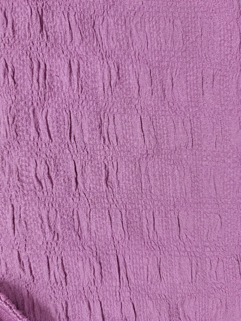 Close-up of textured purple fabric