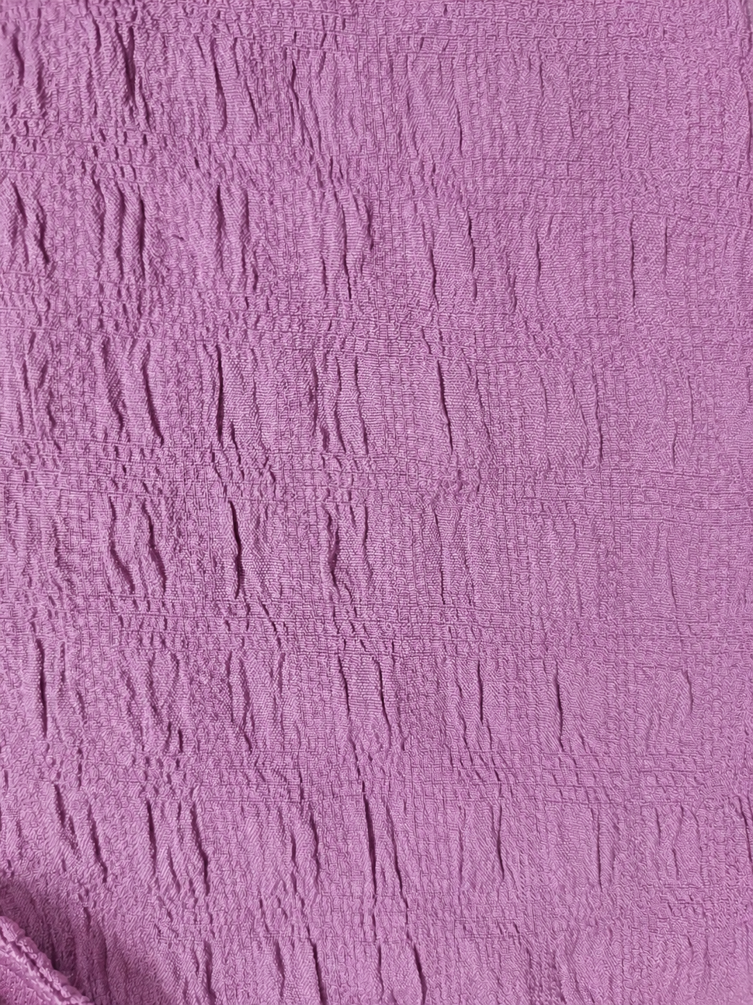 Close-up of textured purple fabric